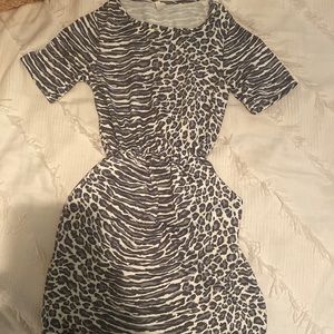 This dress is Cheetah print with pockets! Smoke free home only worn once.